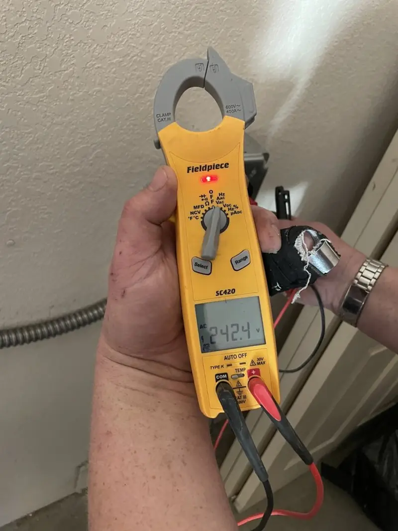 Voltage testing with clamp meter during Generator Installation in Ludlow